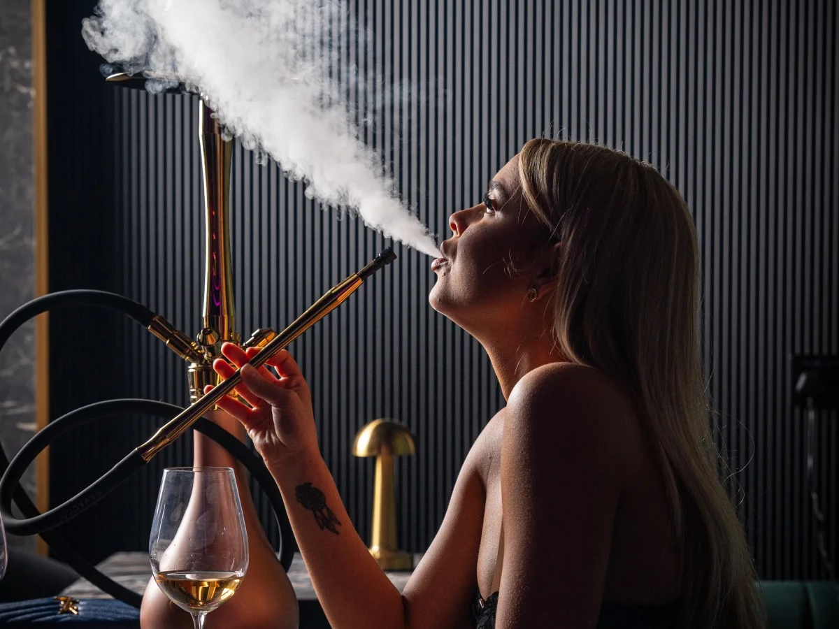 Guest enjoying shisha in the lounge at Al Alamy Bali in Seminyak
