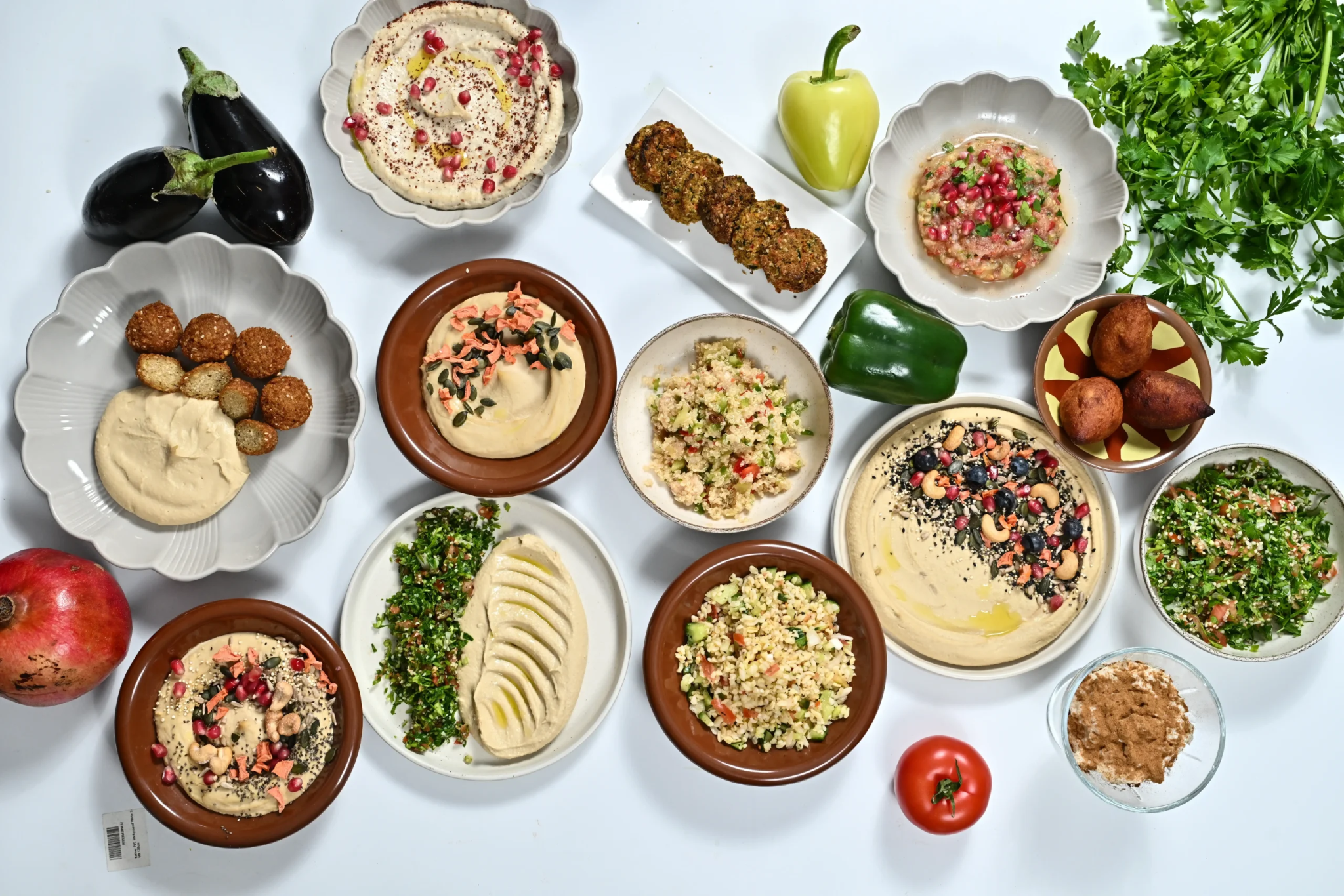Lebanese mezze spread at Al Alamy Bali in Seminyak, with hummus, tabbouleh, dips and fresh herbs
